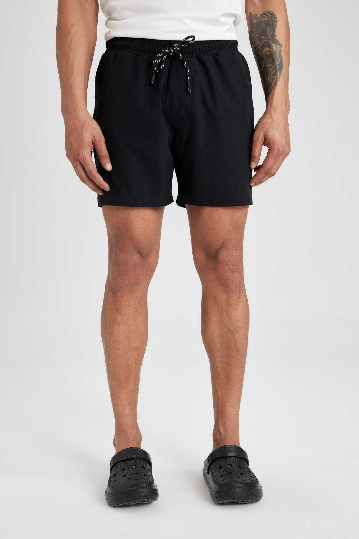 شورت شنای کوتاه بافت انعطاف پذیر چاپ شده DeFactoFit