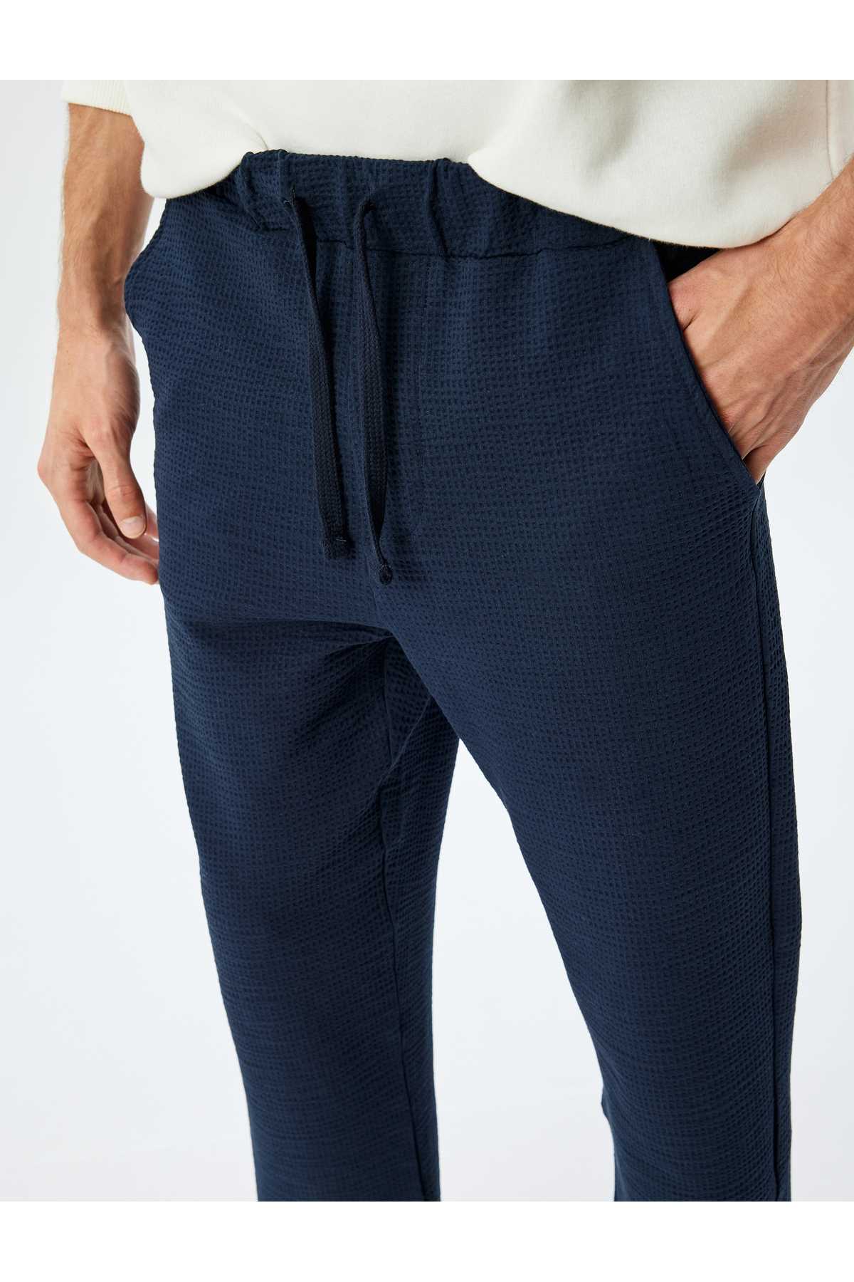 شلوار ورزشی نخی با جزئیات جیب دور کمر توری